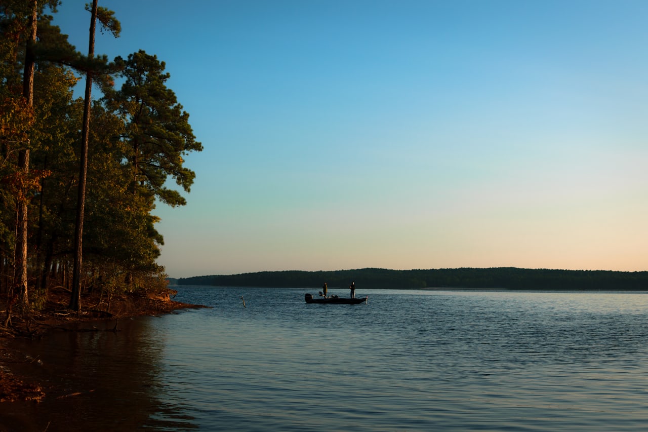 Angler fishing from boat at sunrise on Florida saltwater flats
