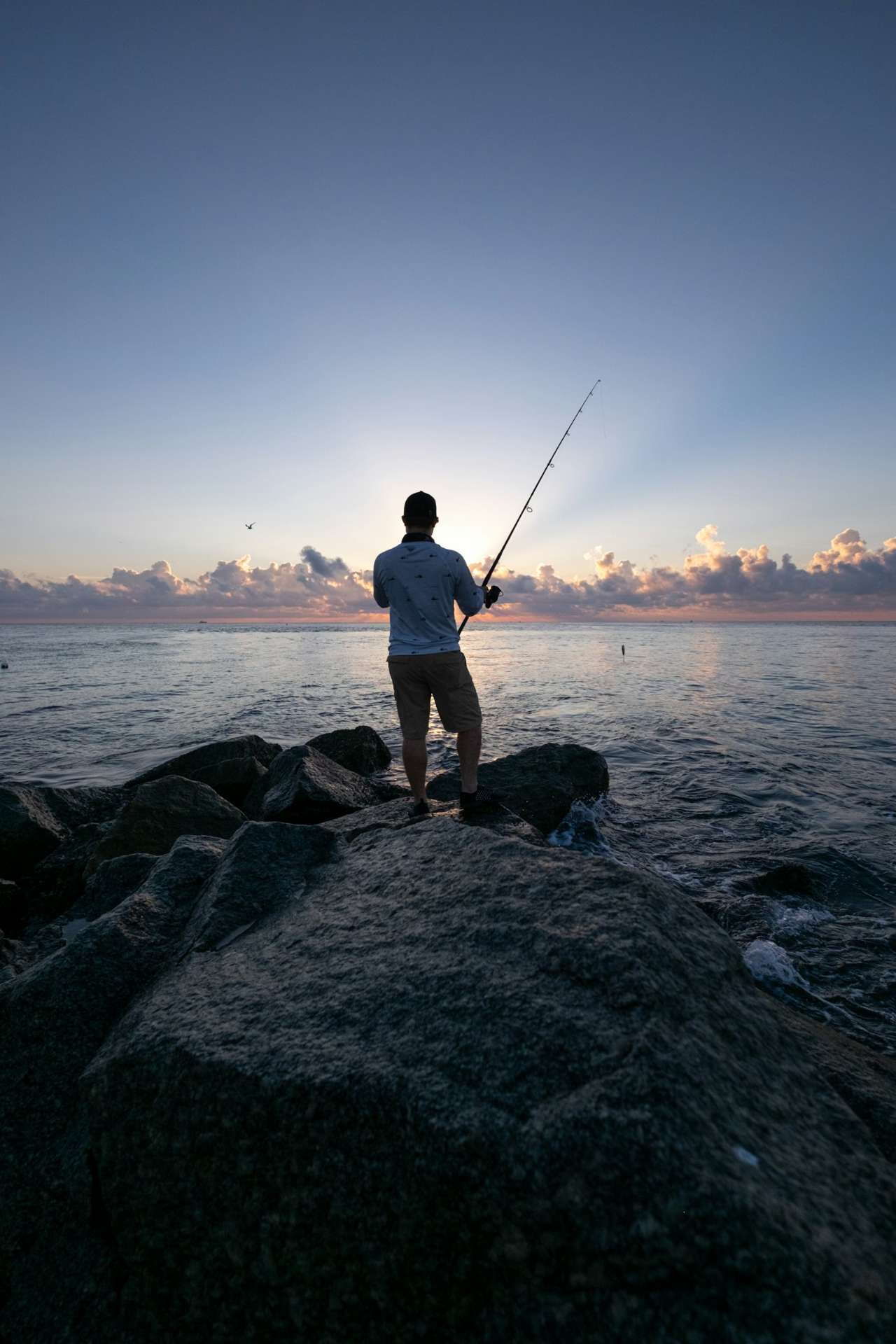 Angler fishing inshore Florida flats for spotted seatrout