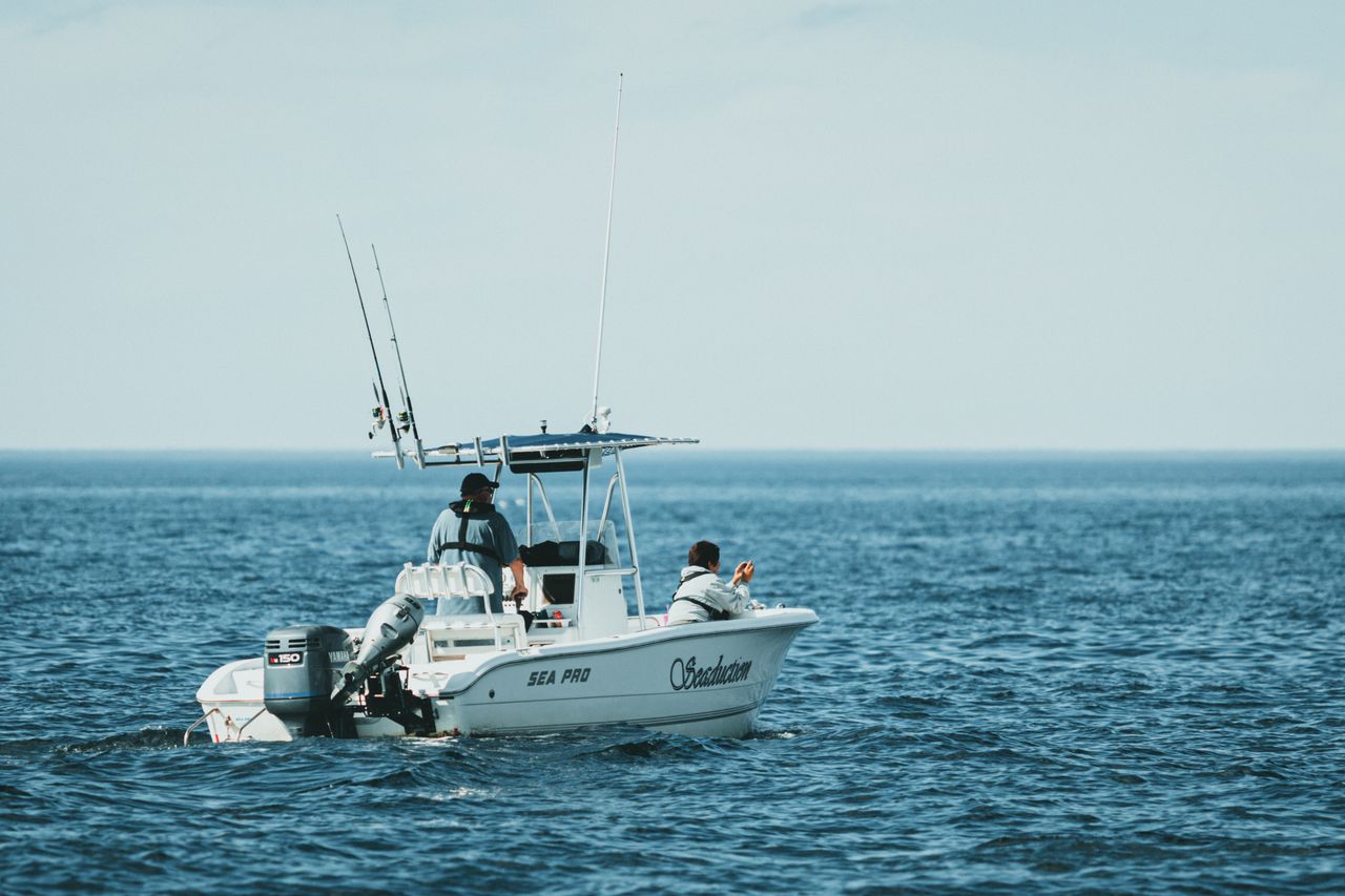 Center-console fishing boat on calm Florida water in summer