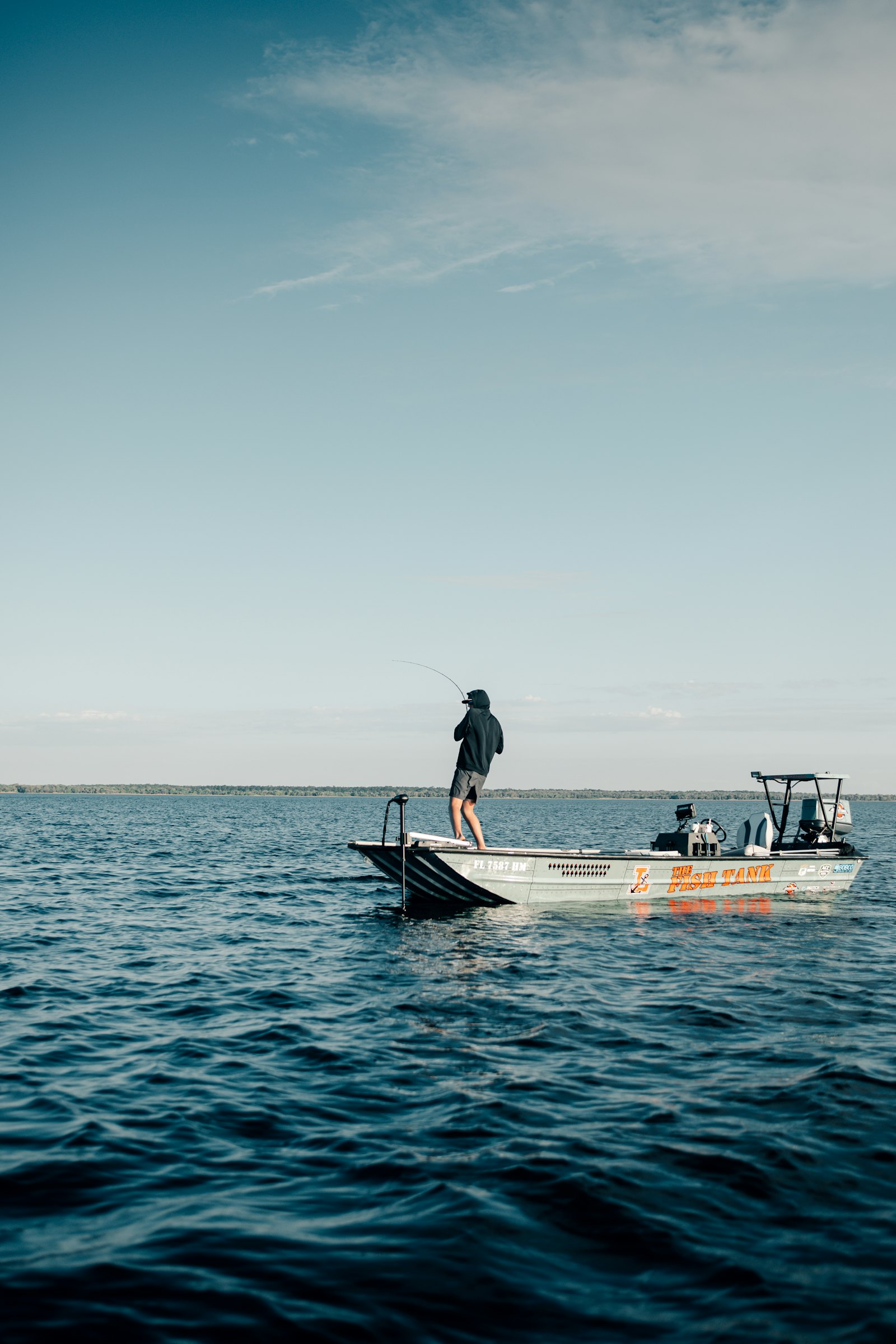 Angler on a flats boat fishing shallow inshore water in Florida