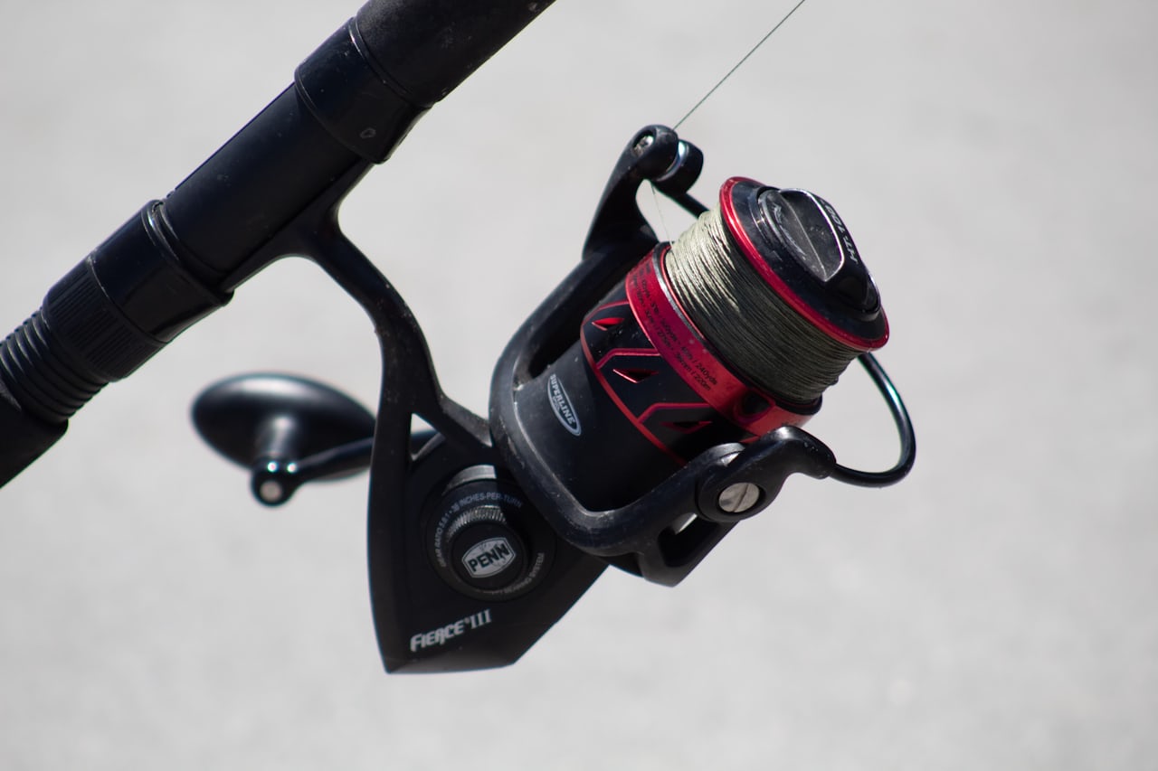 Inshore spinning reel mounted on a fishing rod over the water