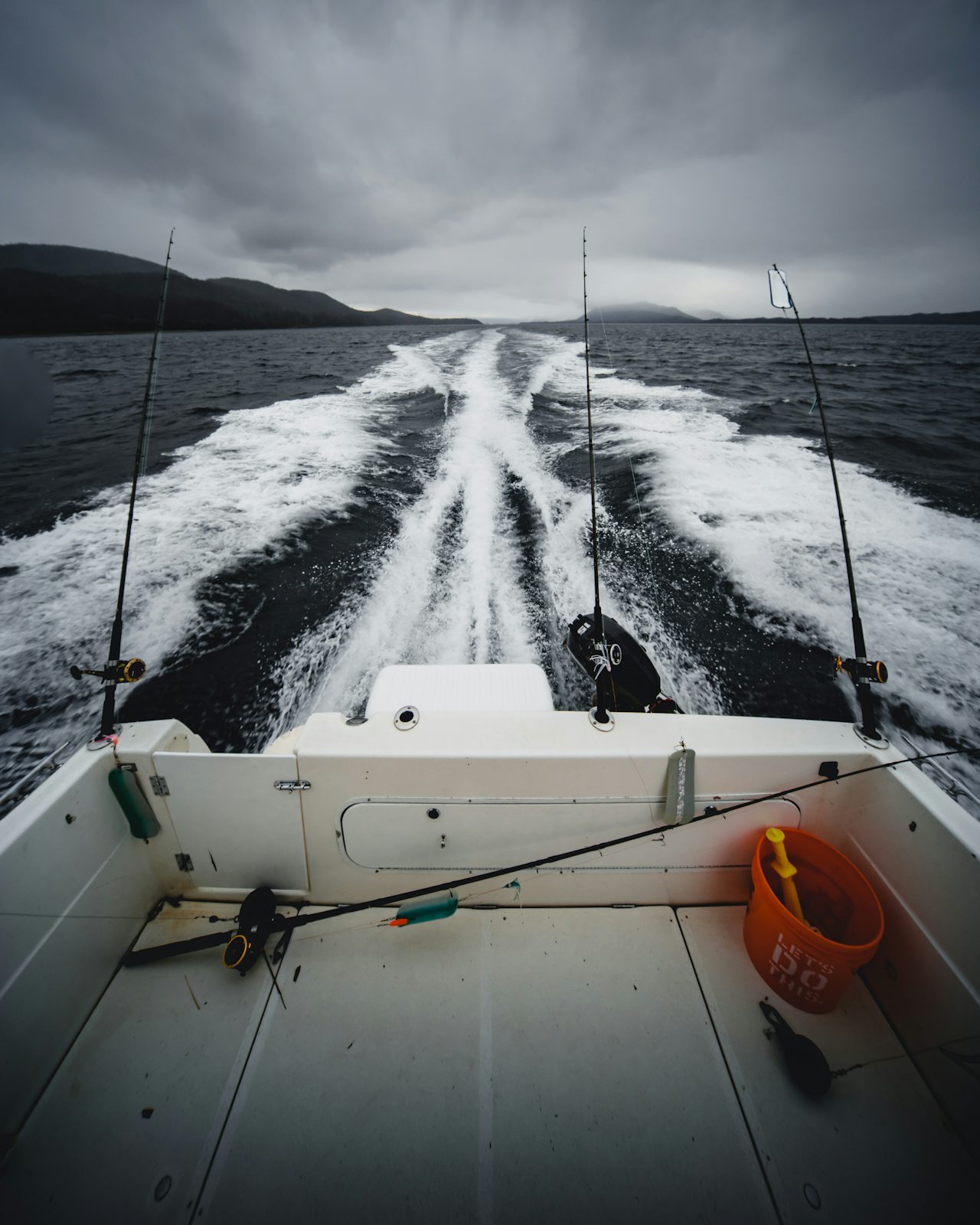 Fishing rods on a speeding boat for tarpon fishing in Florida